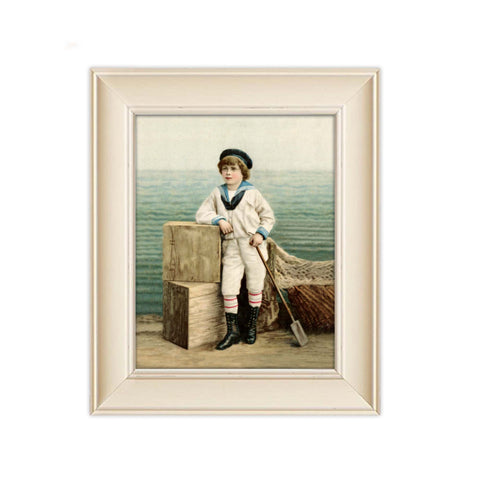 A young boy dressed in a sailor outfit and hat rests his right elbow on seaside crates and holds an oar in his left hand. This Antique Trading Card print presents soft seaside colors with rippling ocean waves in the background. His black shoes with striped socks certainly creates a confident seaside pose! Vintage print reproduction measures 8 x 10 inches. Printed on durable cover stock with soft velvet finish. tribegift.com