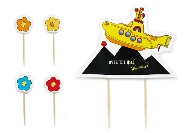 A bold and brave Yellow Submarine makes its way over the peak of a mountain within this cake topper.  This is no average “Over the Hill Party” experience. We are talking mountains - not hills. Cake topper showcases a yellow submarine making its way over a mountain peak. Four flower cake picks come with this cake topper. All picks are made out of 100% Natural Bamboo - biodegradable! - tribegift.com