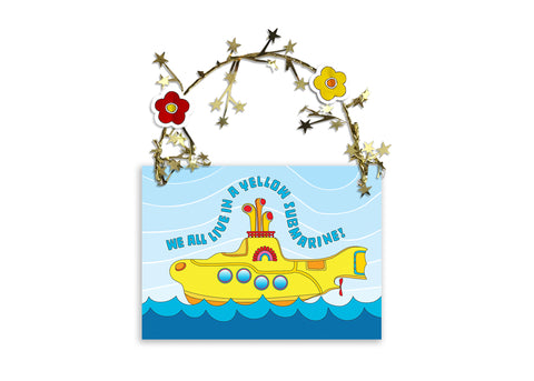 Beatles Party Favors - Colorful and sparkling Yellow Submarine party favor for special guests or a gift for you!  A Yellow Submarine sails the sea amid golden garland reflections. Unique one-of-a-kind gift that says, “Thank you for coming to my Yellow Submarine party!” Two-sided art measures 3.625 x 2.75 inches. Printed on stock with soft velvet finish. Two flower heads accent a golden star-wired garland hoop affixed to the top - works perfect for hanging! Great way to say thank you in Beatle language! 