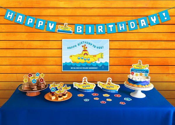 Yellow Submarine Party Supplies - colorful vibrant Yellow Submarine Party Pack! Includes pennant banner, poster, cut-out décor, cake topper and food picks. Pennant banner comes fully assembled and measures 74 inches wide. Poster measures 13 x 19 inches. Cut-out decor is easily assembled and measures 5 1/2 inches high by 9 1/2 inches wide. Cake topper measures 9 1/2 inches high by 7 1/4 inches wide. 16 Food Picks are made with 100% natural bamboo – biodegradable!  – tribegift.com